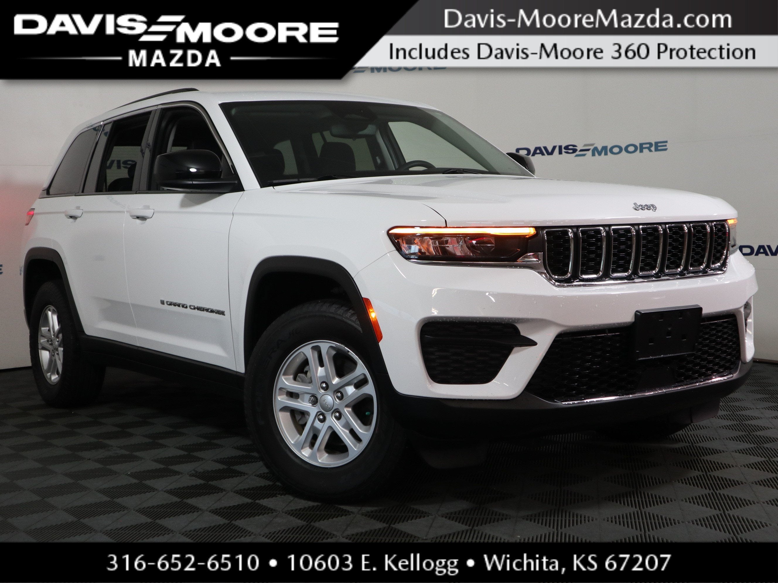 2023 Jeep Grand Cherokee Laredo in Bright White Clearcoat — front three-quarter view