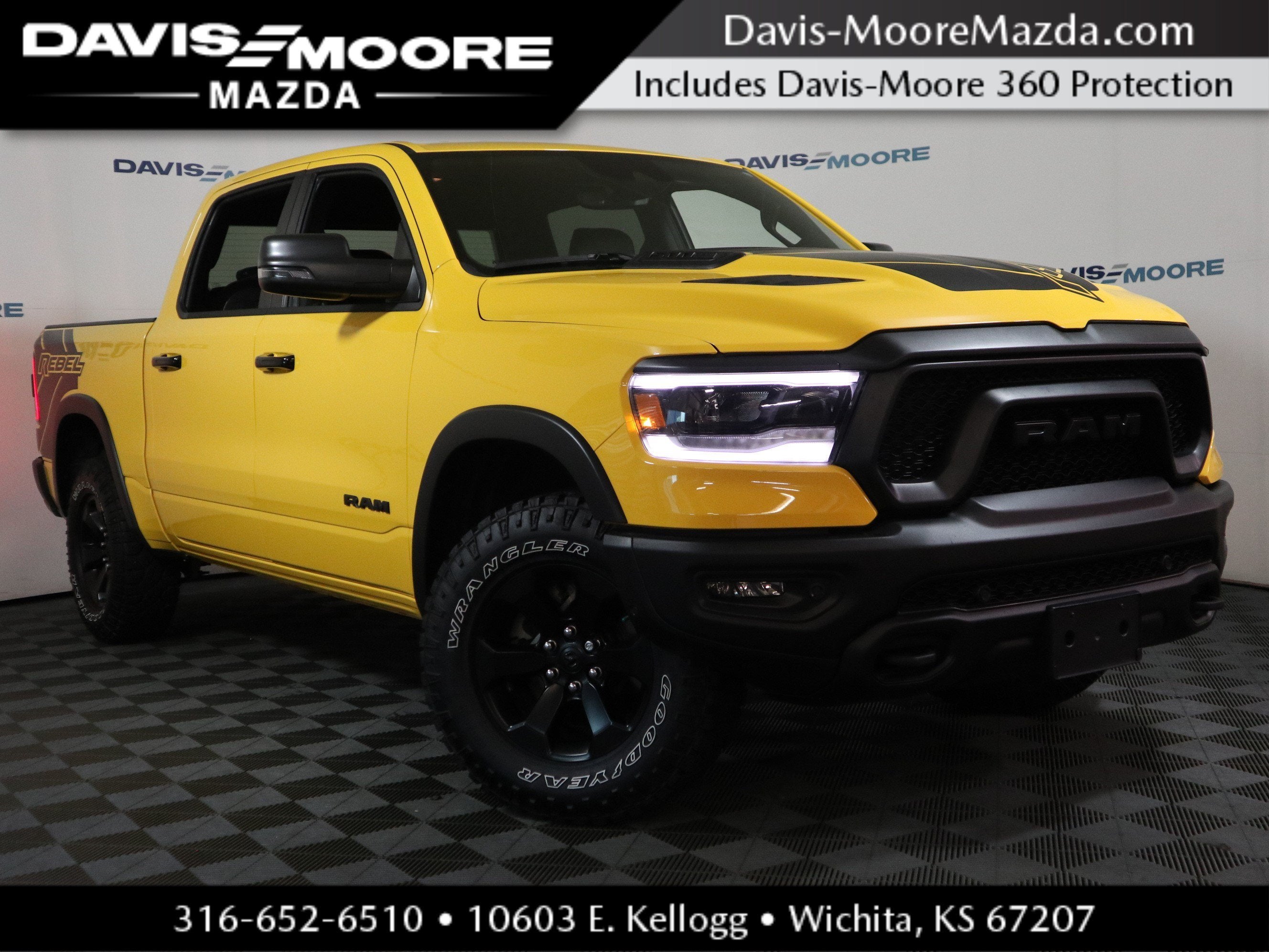2023 RAM 1500 Rebel in Baja Yellow Clearcoat — front three-quarter view