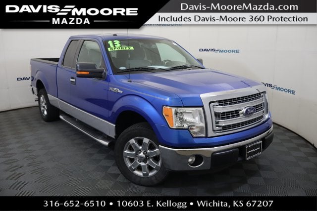 2013 Ford F-150 XLT in Blue Flame Metallic — front three-quarter view