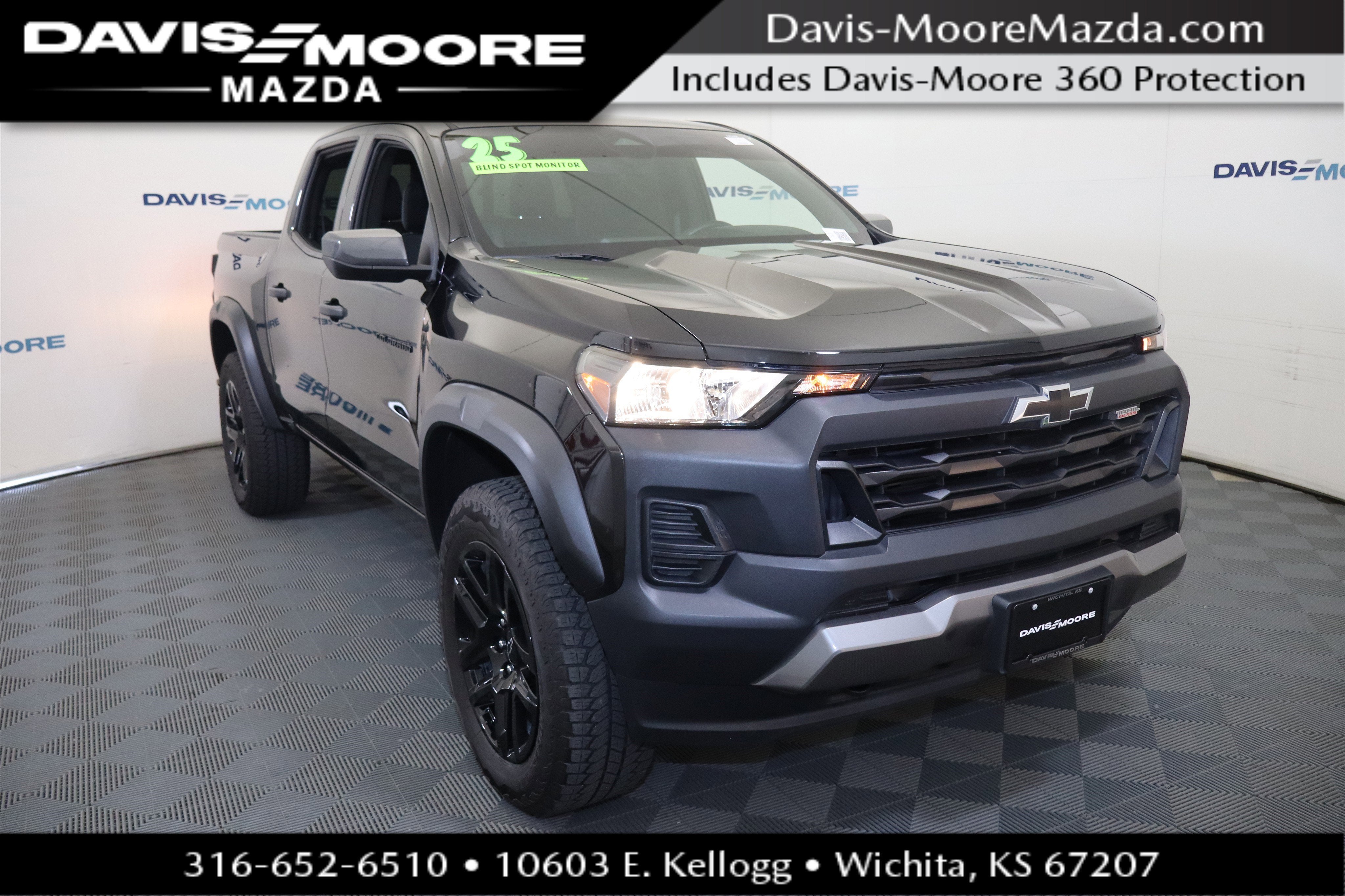2025 Chevrolet Colorado 4WD Trail Boss in Black — front three-quarter view