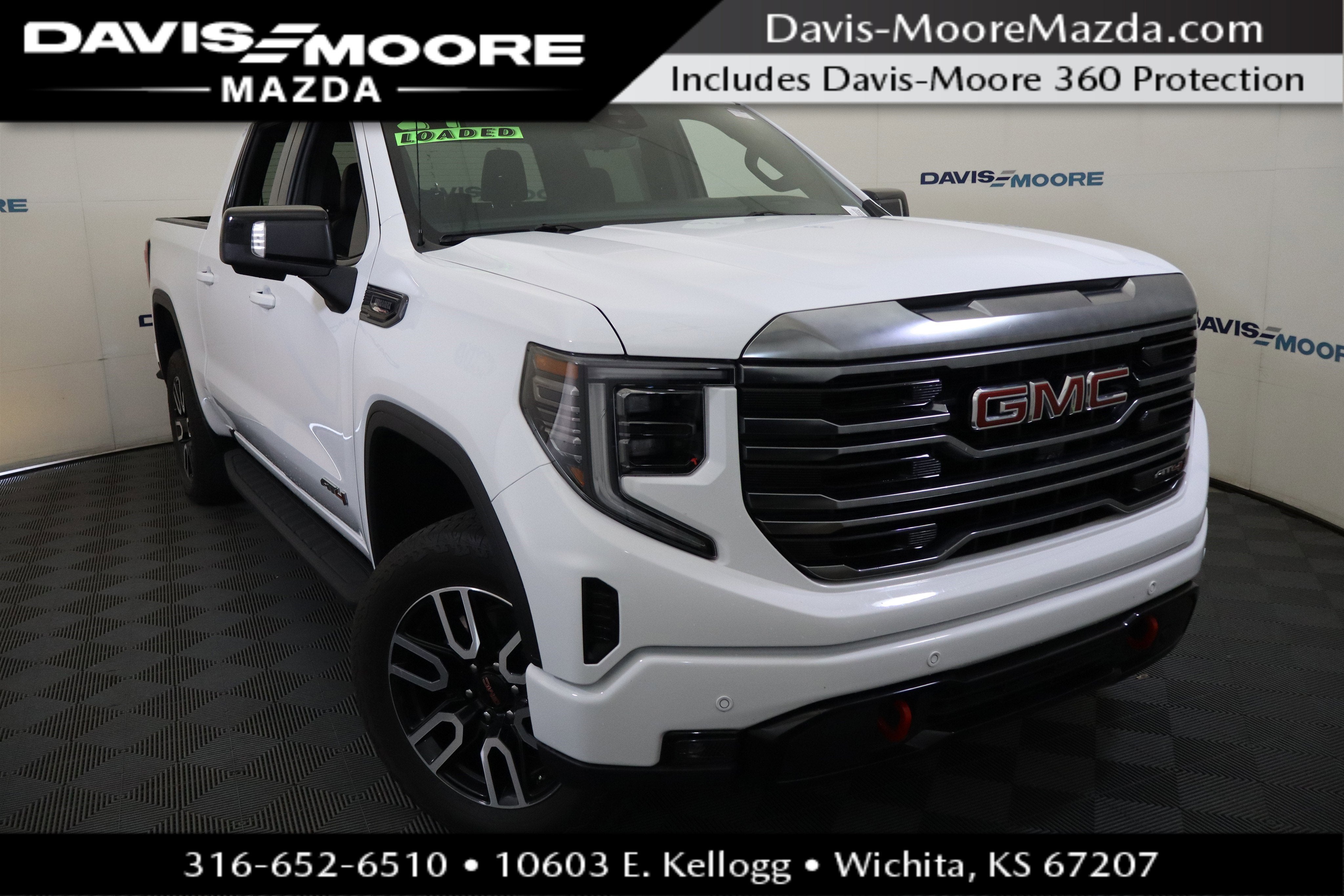 2024 GMC Sierra 1500 AT4 in Summit White — front three-quarter view